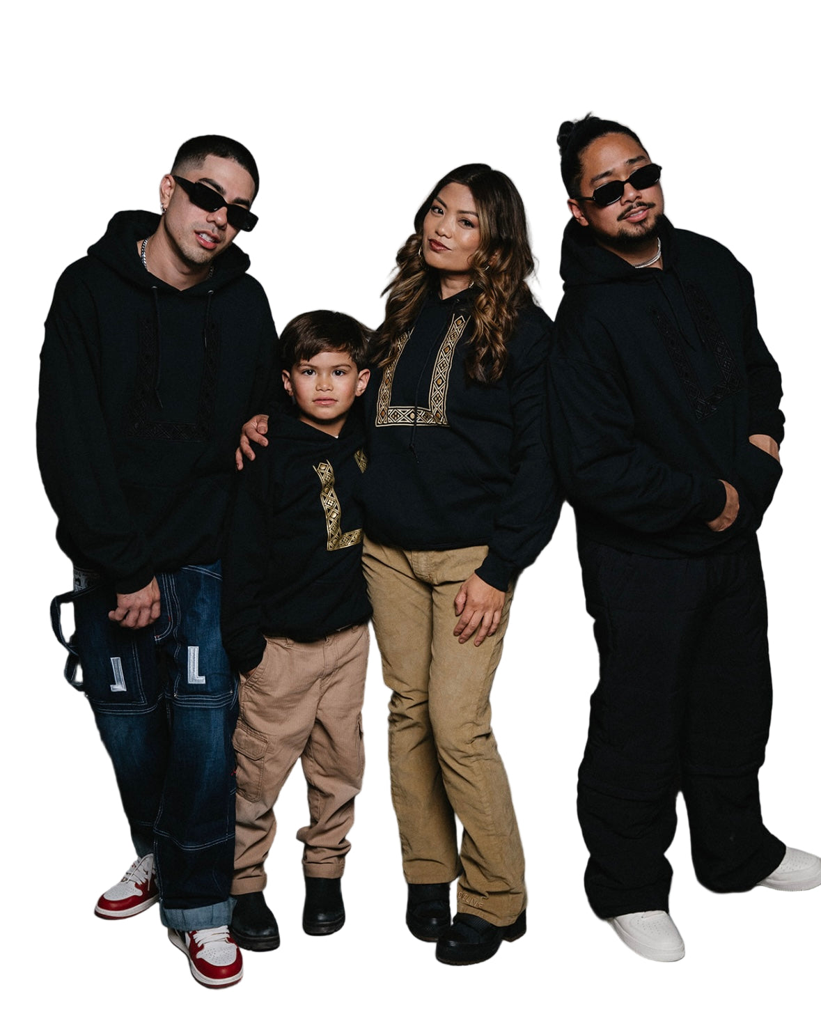 Family of 2 males, 1 female and 1 child wearing matching barong pullover hoodies 