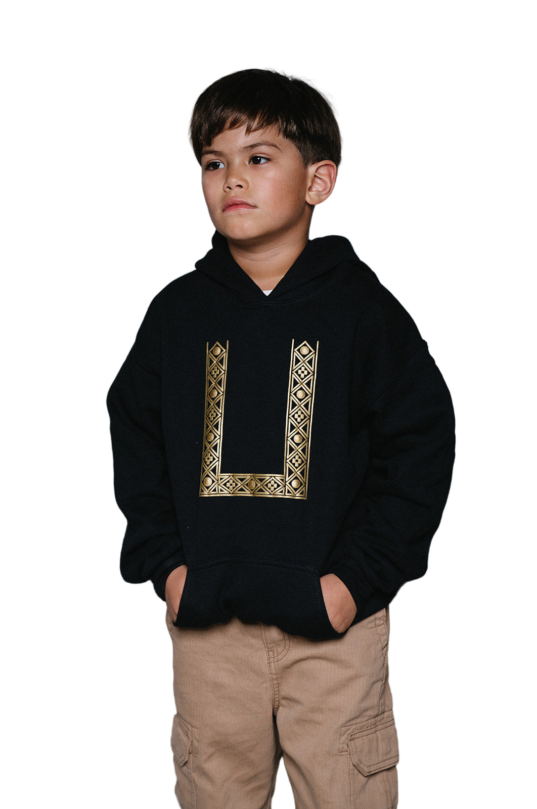 Young child wearing a pullover black hoodie with gold geometric screenprinted barong pattern